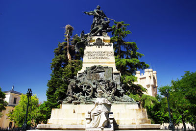 Low angle view of statue against sky