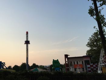 Low angle view of tower against blue sky