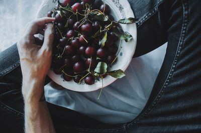 High angle view of man holding fruit