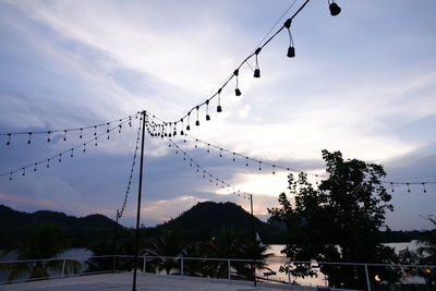 Low angle view of silhouette birds against sky at sunset