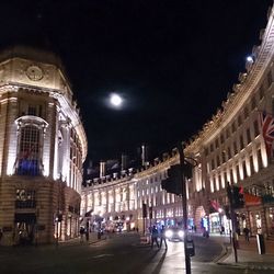 Buildings in city at night