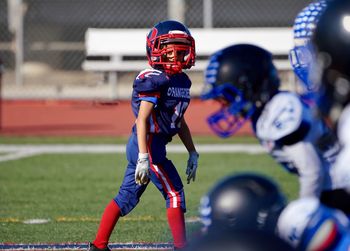 Boy playing with umbrella