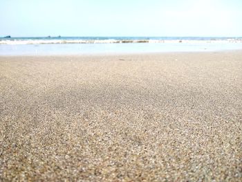 Surface level of beach against sky