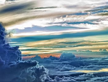 Aerial view of landscape against cloudy sky