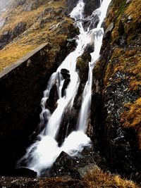 View of waterfall along rocks