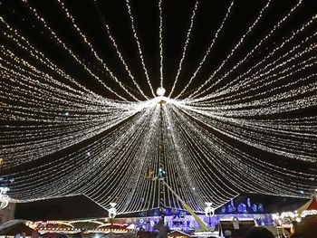 Low angle view of illuminated ferris wheel