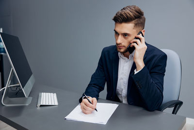 Businesswoman working at desk in office