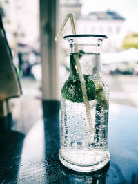 Close-up of glass of jar on table