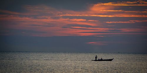 Scenic view of sea against sky at sunset