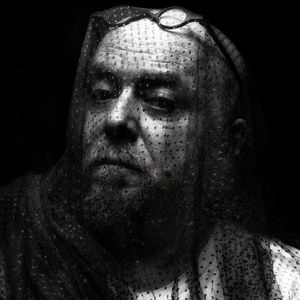 Close-up portrait of mid adult man