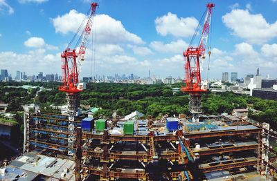 Construction site against cloudy sky