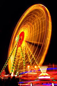 Low angle view of illuminated ferris wheel