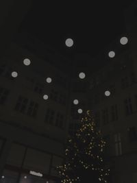 Low angle view of illuminated building at night