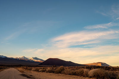 Scenic view of desert against sky during sunset