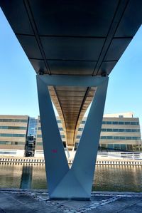 Low angle view of modern building against blue sky