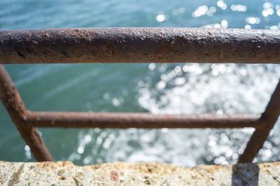 Close-up of railing against the sky