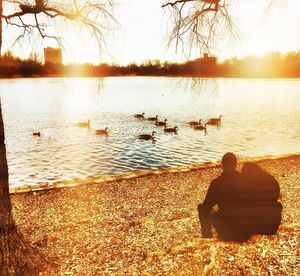 Scenic view of lake at sunset