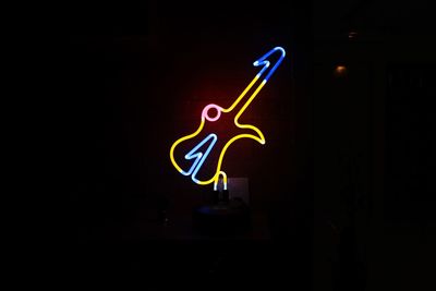 Man against black background