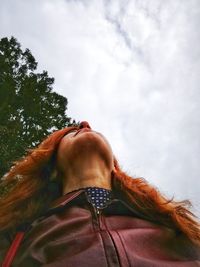 Low angle view of woman against sky