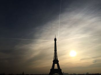 Low angle view of silhouette built structure against sky