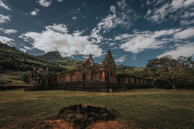 View of temple building against cloudy sky