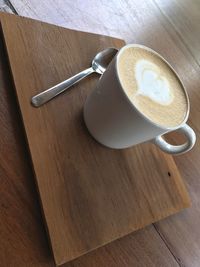 High angle view of coffee cup on table