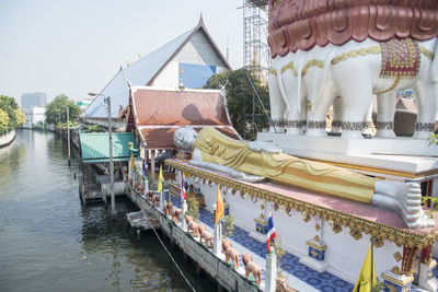 Panoramic view of river by buildings against sky