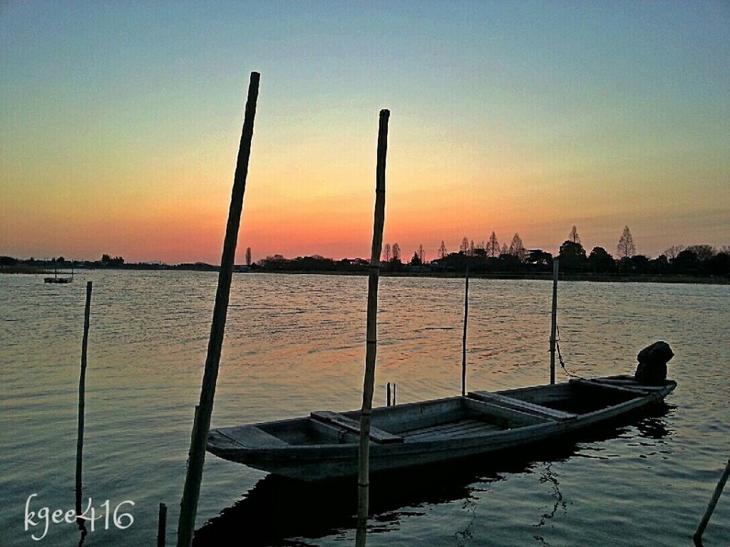 water, sunset, nautical vessel, sea, transportation, boat, mode of transport, moored, tranquility, tranquil scene, scenics, orange color, beauty in nature, clear sky, silhouette, nature, sky, pier, idyllic, reflection