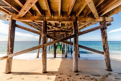 Pier over sea against sky