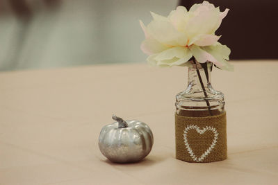 Close-up of flower vase on table