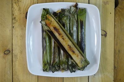 High angle view of fish in plate on table