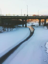 Snow covered bridge against sky