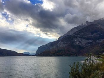 Scenic view of mountains against cloudy sky