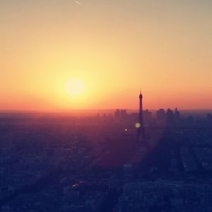 View of buildings in city during sunset