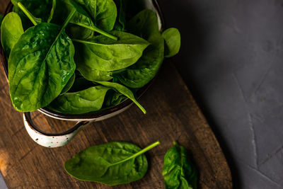 Close-up of baby spinach leaves on table