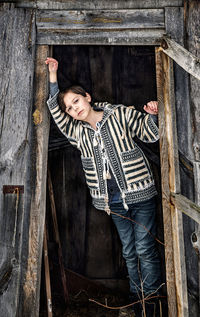 Portrait of kid standing in the doorway