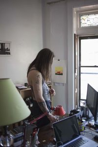 Young man working in his home office