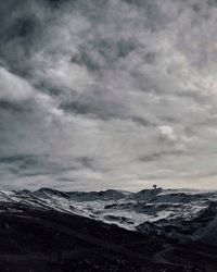 Scenic view of snowcapped mountain against sky