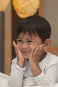 Close-up of cute boy looking away