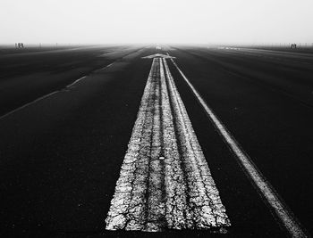 Empty road along landscape