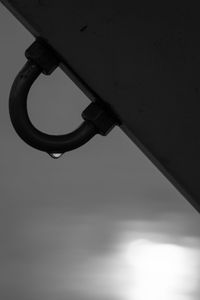 Low angle view of metal against sky