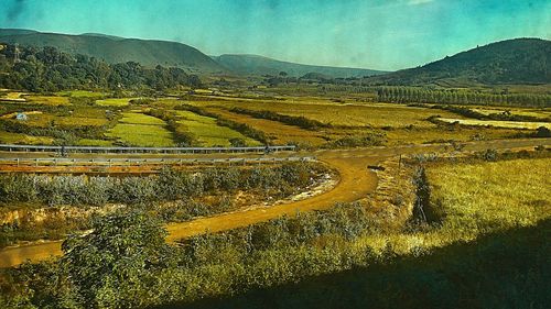 Aerial view of agricultural landscape against sky