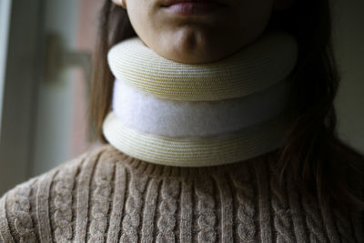 Young woman with a cervical collar.