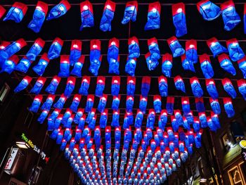 Low angle view of illuminated lanterns hanging in building