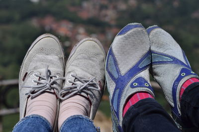 Low section of people wearing shoes outdoors