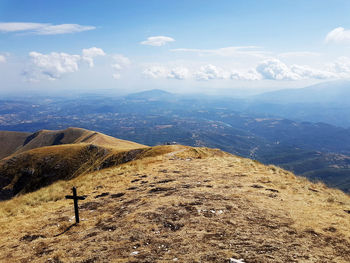 Scenic view of landscape against cloudy sky