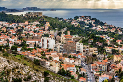 High angle view of townscape by sea