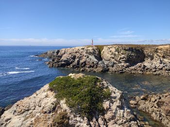 Scenic view of sea against clear blue sky
