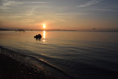 Scenic view of sea against sky during sunset