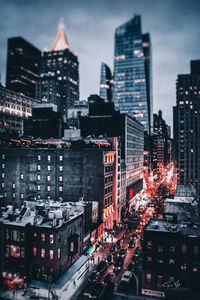 High angle view of illuminated buildings in city